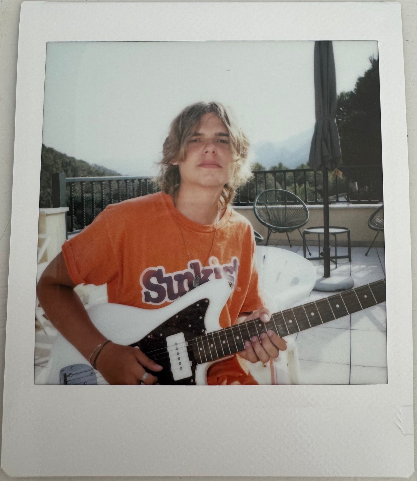 ONE UNIQUE SIGNED POLAROID PHOTO