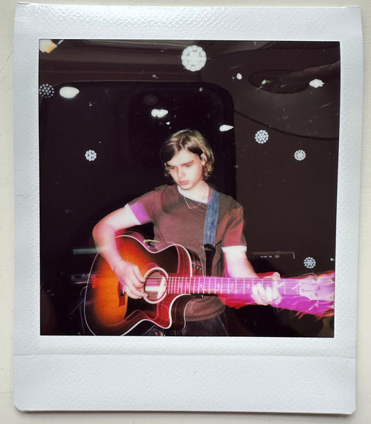ONE UNIQUE SIGNED POLAROID PHOTO