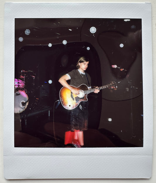 ONE UNIQUE SIGNED POLAROID PHOTO